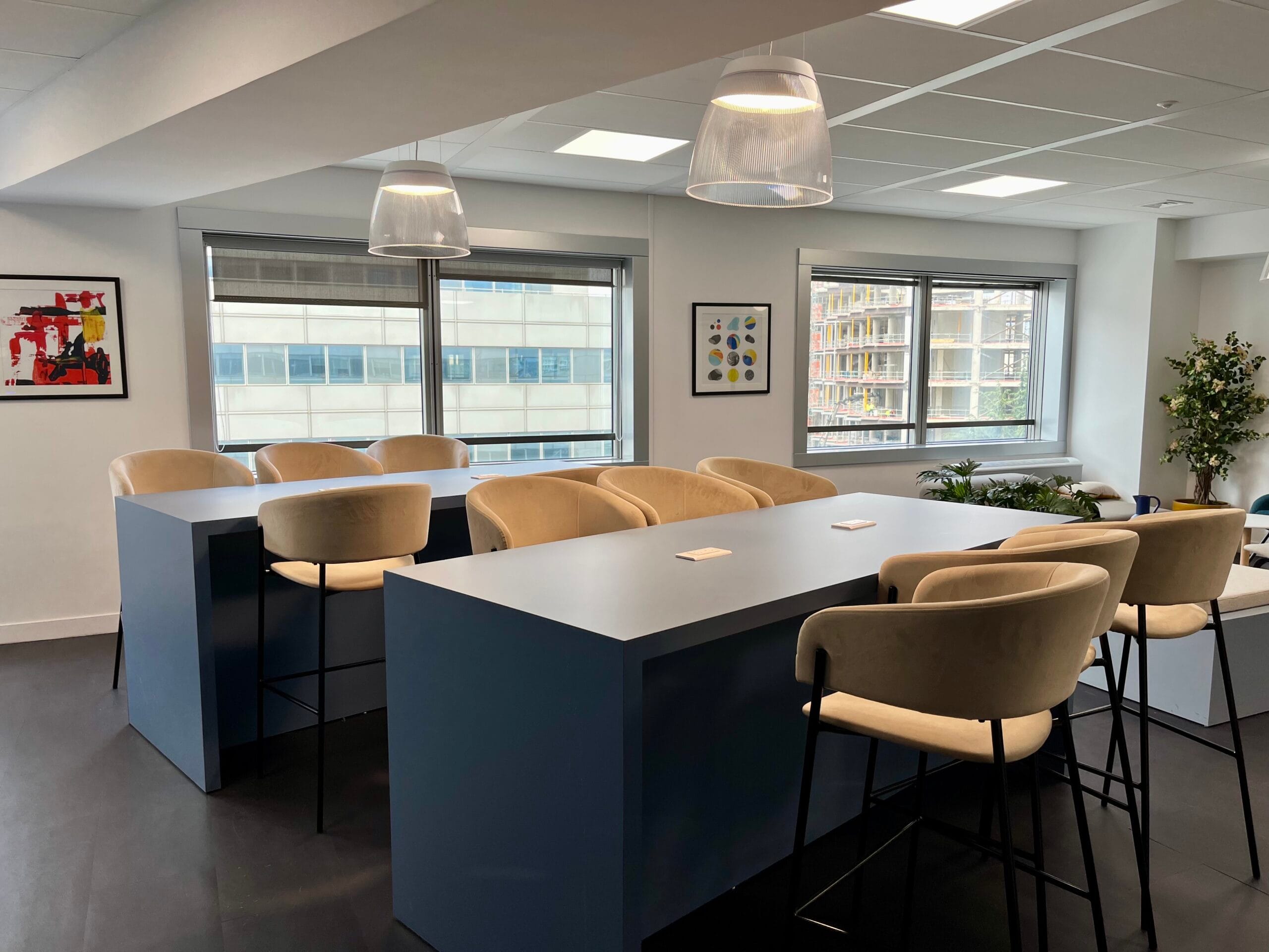 Spacious white-toned French classroom equipped with modern learning amenities in Paris