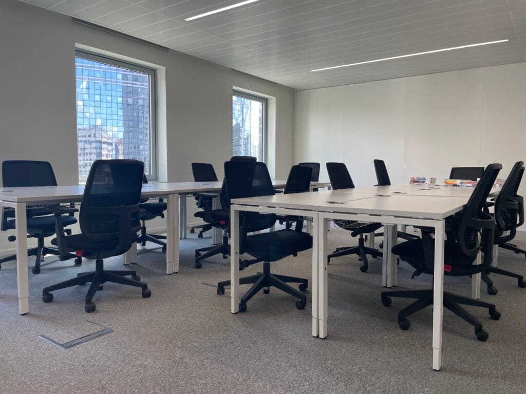 FTC Paris classroom seen from the doorway, with desks and bright windows