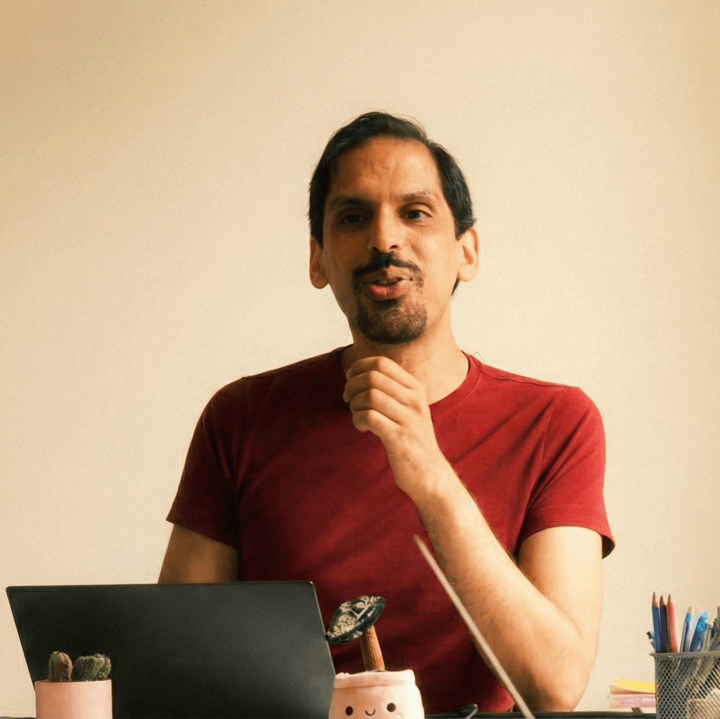 Native French teacher Otman conducting an online conversation class